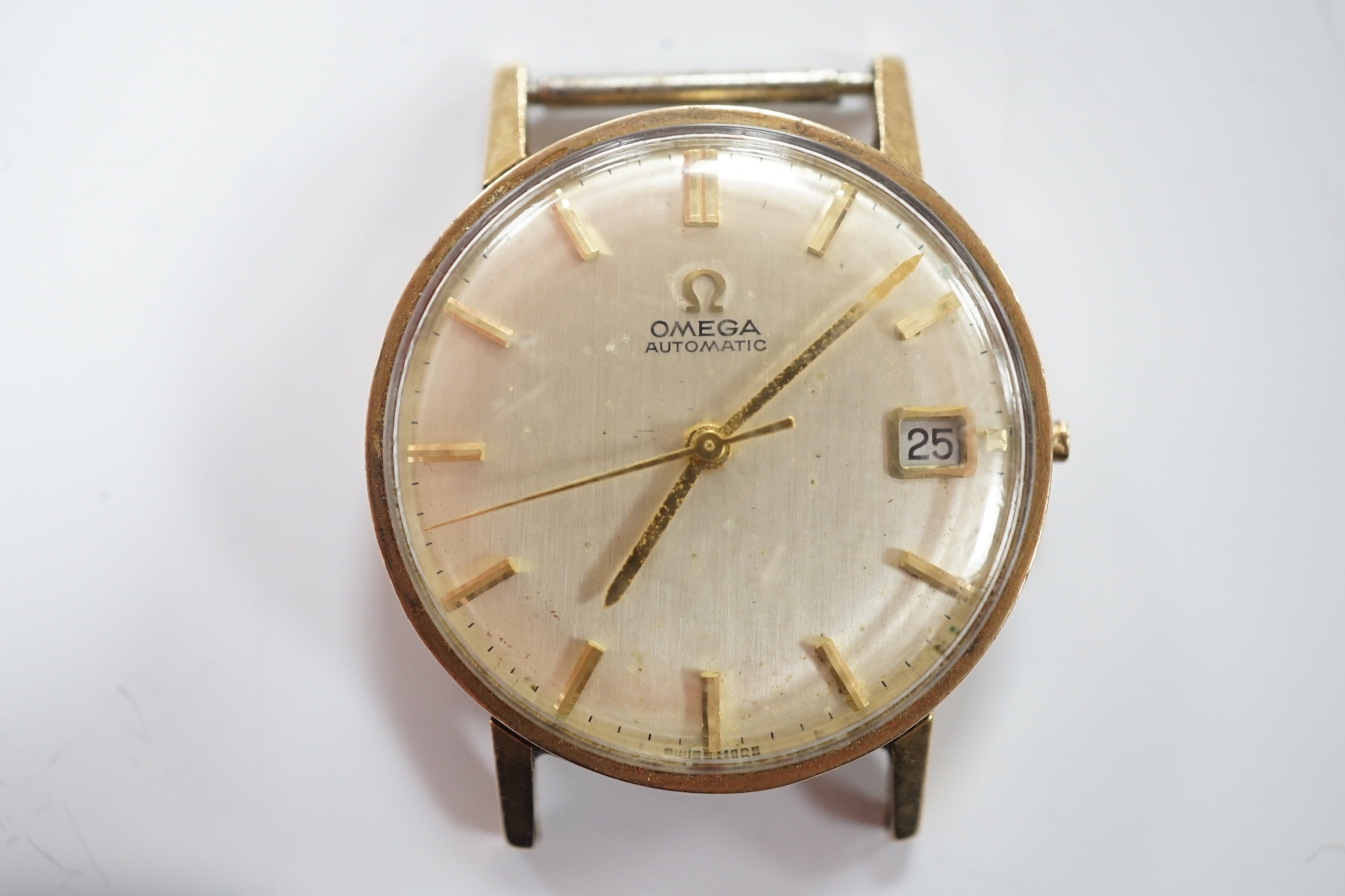 A gentleman's 9ct gold Omega automatic wrist watch, with date aperture, no strap or winding crown.